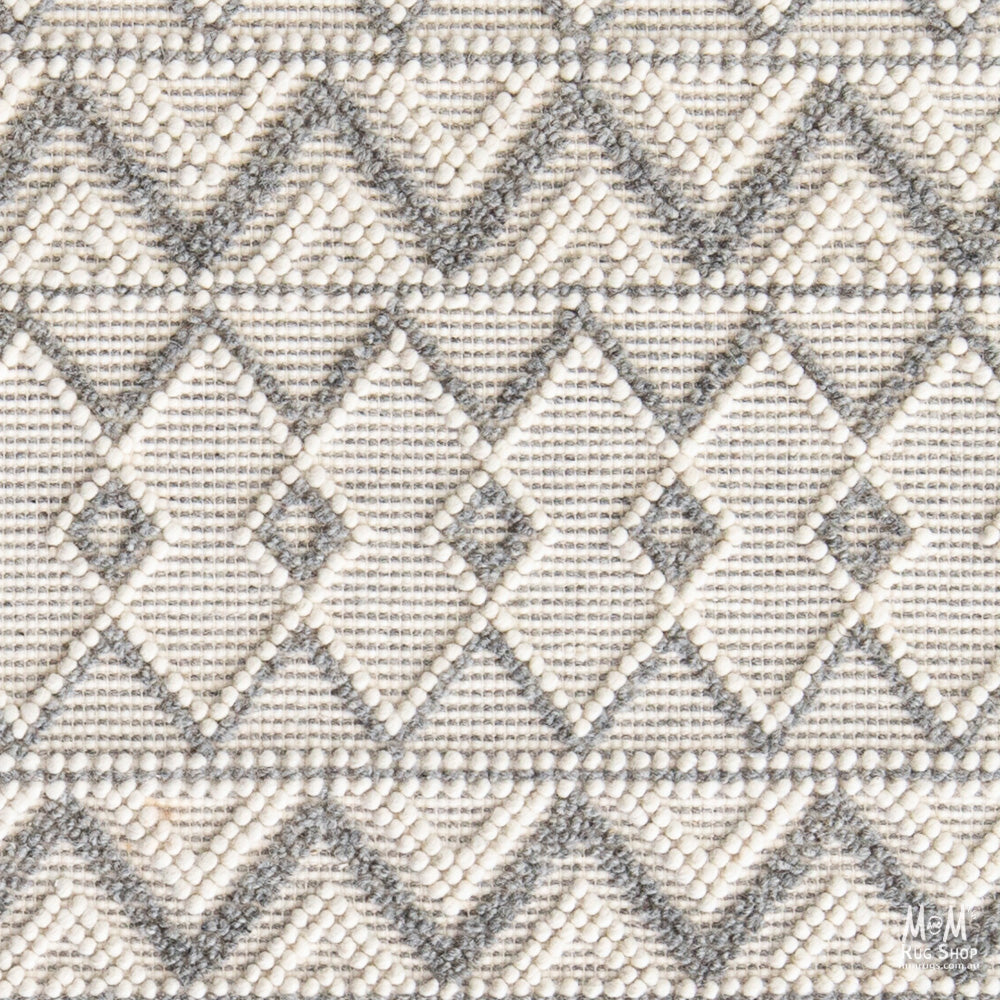 India Memphis Maya pure wool rug with intricate geometric patterns and vibrant colors in a traditional design.