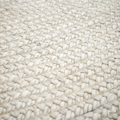 Wool and viscose Paddington Snow rug by India featuring a soft, textured snow-inspired pattern in neutral tones.
