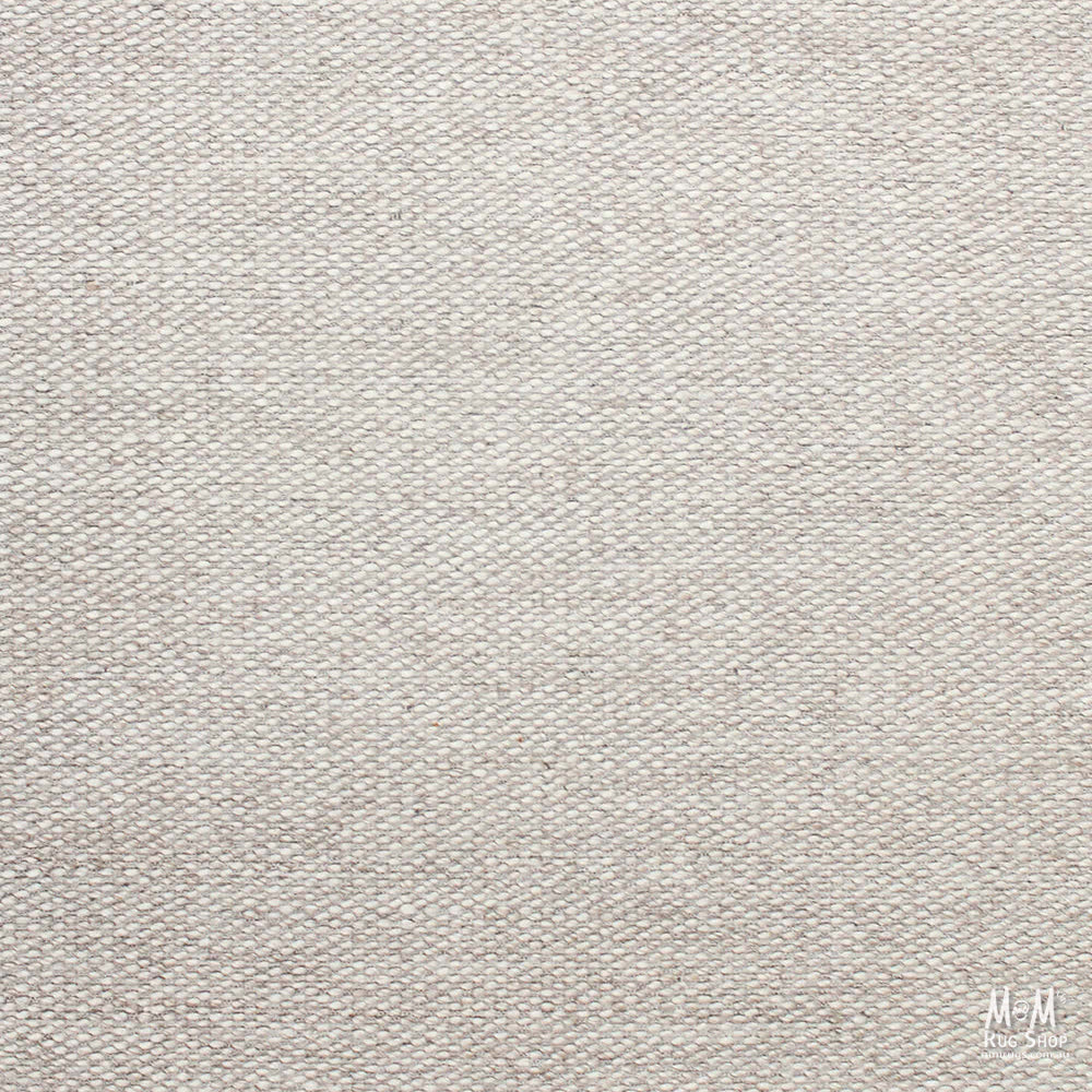 India Palmas Beige pure wool rug with intricate patterns, showcasing soft beige tones and woven texture.