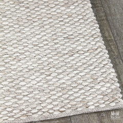 India Palmas Beige pure wool rug with intricate patterns, showcasing its soft texture and elegant design.