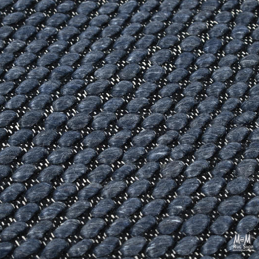 India Palmas Midnight Blue pure wool rug featuring a deep blue pattern and soft texture.