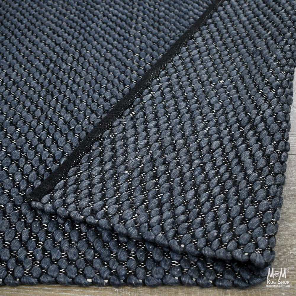 India Palmas Midnight Blue pure wool rug with intricate patterns and rich blue tones, showcasing traditional craftsmanship.