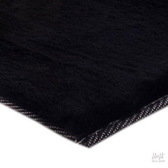 Black Pony rug made from supersoft polyester fabric, featuring a sleek and durable design.