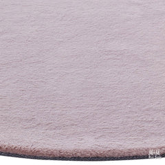 Dusty pink round pony-shaped rug made of supersoft polyester, soft and plush for cozy decor, by China.