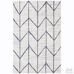 Navy polypropylene Prisma Arrow rug by Belgium with geometric arrow pattern, textured surface, and soft pile.