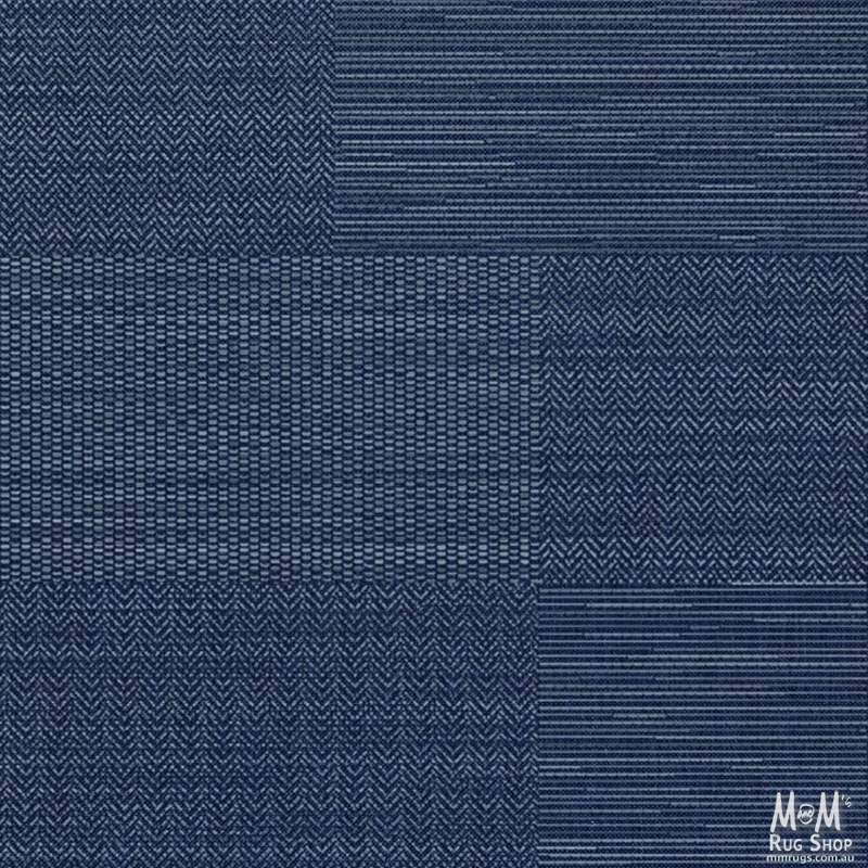Navy blue polypropylene Prisma Patch Rug by Belgium with geometric pattern and textured surface, suitable for modern home decor.