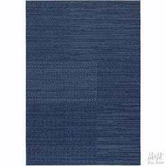 Navy blue polypropylene Prisma Patch rug by Belgium with a textured woven surface and rectangular shape.