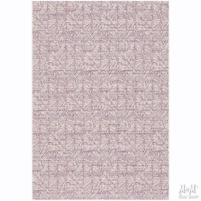 Pink polypropylene Prisma Triline Belgium rug with geometric pattern, showcasing soft texture and vibrant color.