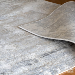 Raj Grey polyester pile rug from Turkey, showcasing soft, textured grey fibers with intricate weaving.