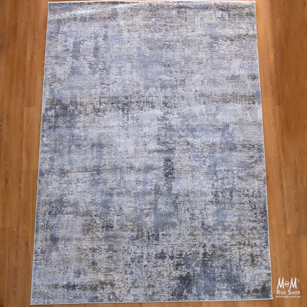 Turkish Raj Taupe polyester pile rug showing soft taupe color and textured surface in a close-up view.