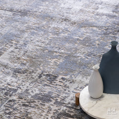 Turkish Raj Taupe polyester pile rug with a soft, plush texture and taupe color, showing intricate woven pattern on a neutral background.