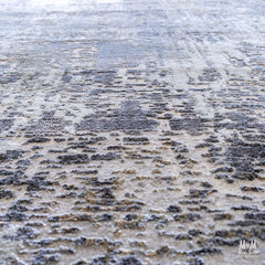Turkish Raj Taupe polyester pile rug with soft, textured fibers in a taupe color, showcasing intricate woven patterns.